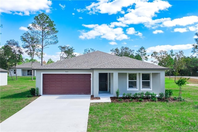 ranch-style house featuring a garage and a front lawn