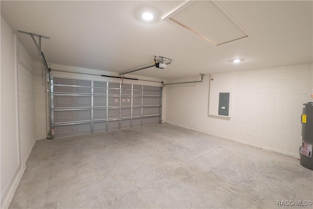 garage featuring electric panel, a garage door opener, and water heater