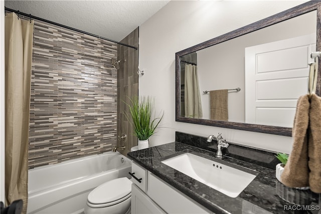 bathroom with toilet, vanity, a textured ceiling, and shower / bath combo with shower curtain