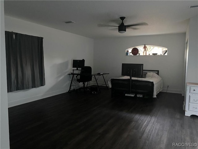 bedroom featuring dark hardwood / wood-style flooring and ceiling fan