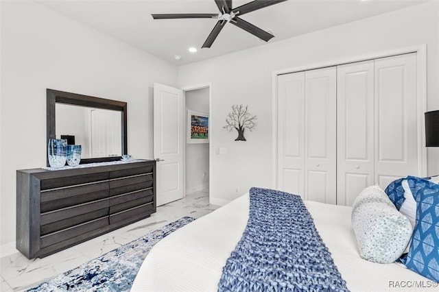 bedroom featuring ceiling fan and a closet