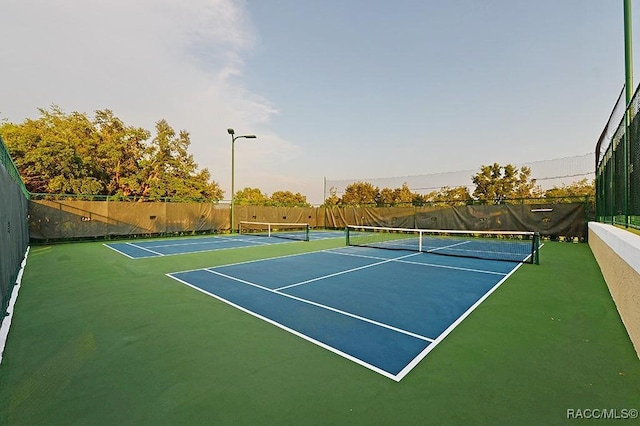 view of tennis court with basketball court