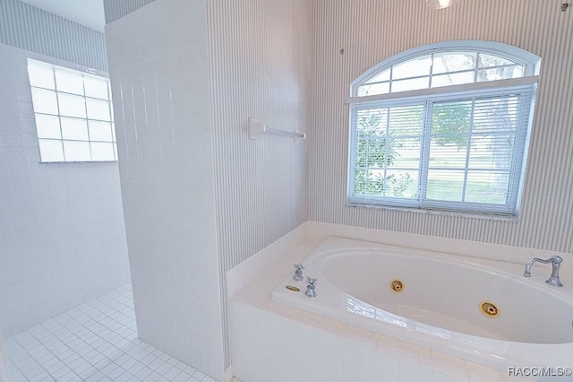 bathroom featuring separate shower and tub