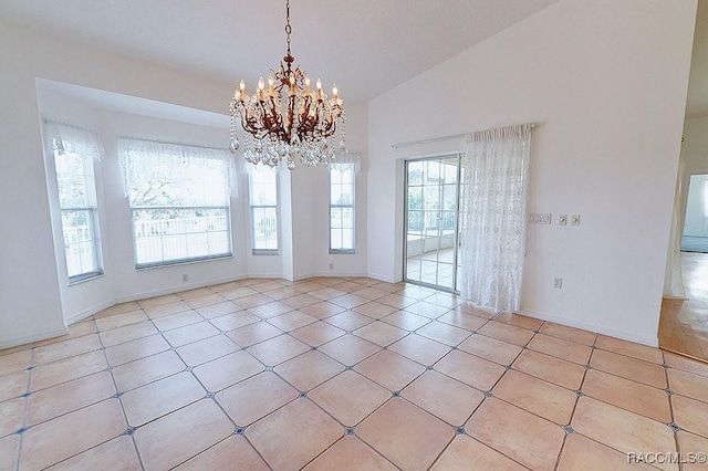 spare room with light tile patterned floors, a chandelier, and vaulted ceiling