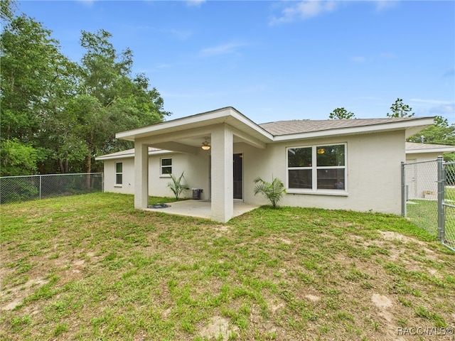 178 W Navarro Pl, Citrus Springs, FL 34434 - rear view of house with a patio area, a gate, and stucco siding