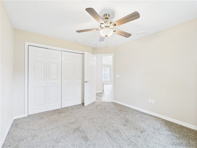 178 W Navarro Pl, Citrus Springs, FL 34434 - unfurnished bedroom featuring carpet floors, baseboards, a closet, and ceiling fan