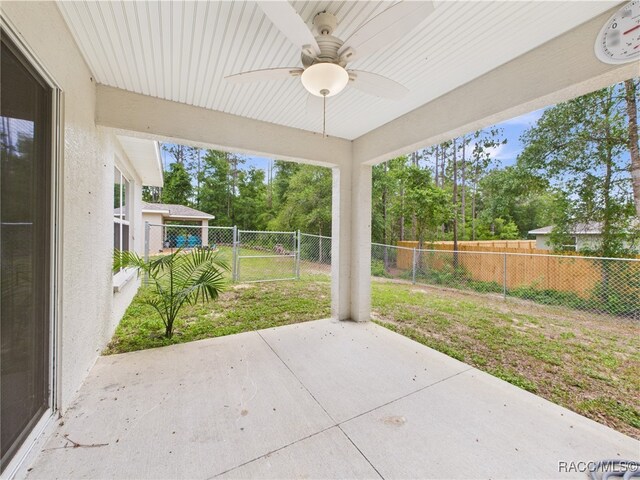 178 W Navarro Pl, Citrus Springs, FL 34434 - view of patio featuring a ceiling fan and view of scattered trees