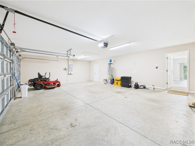178 W Navarro Pl, Citrus Springs, FL 34434 - garage featuring a garage door opener, electric water heater, and electric panel