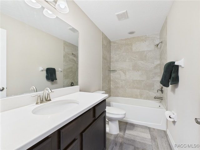 178 W Navarro Pl, Citrus Springs, FL 34434 - full bathroom with toilet, vanity, wood finished floors, and bathing tub / shower combination