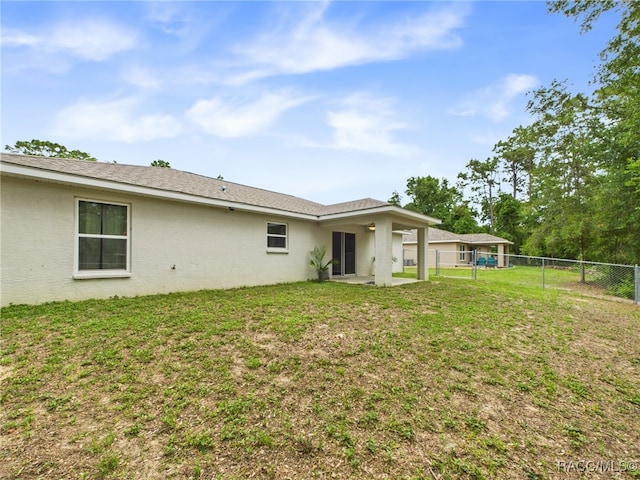178 W Navarro Pl, Citrus Springs, FL 34434 - rear view of property featuring stucco siding and a patio area