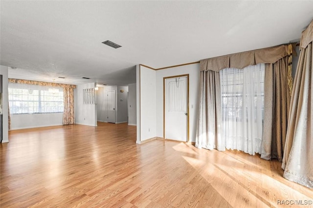 unfurnished living room featuring light hardwood / wood-style flooring