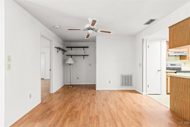 interior space featuring ceiling fan and light wood-type flooring