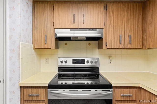 kitchen with backsplash and stainless steel range with electric cooktop