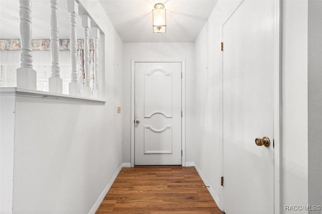 entryway with hardwood / wood-style flooring