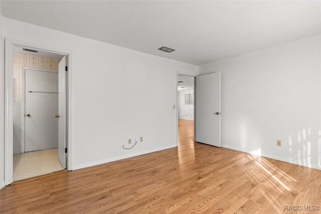 unfurnished room featuring light hardwood / wood-style flooring