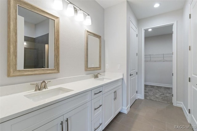 bathroom featuring tile patterned flooring and vanity