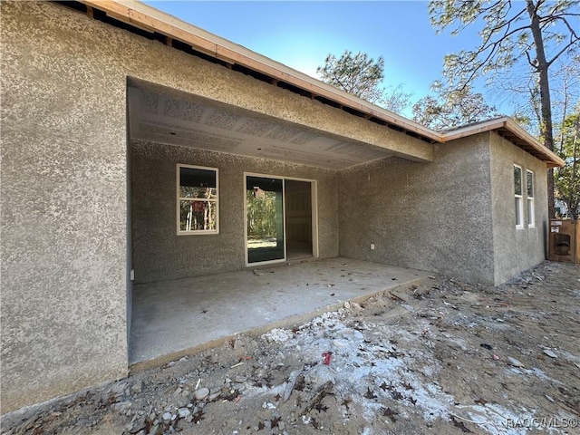 rear view of house featuring a patio area