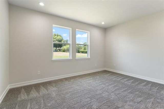 unfurnished bedroom with carpet floors and a closet