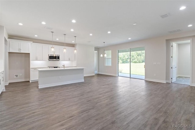 unfurnished living room featuring hardwood / wood-style floors