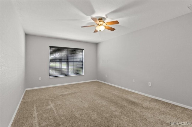 17 Eugenia Ct, Homosassa, FL 34446 - carpeted empty room with baseboards and a ceiling fan