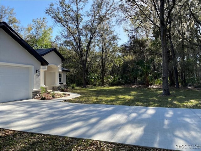 view of yard featuring a garage