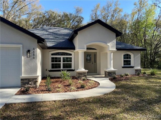 ranch-style house featuring a garage