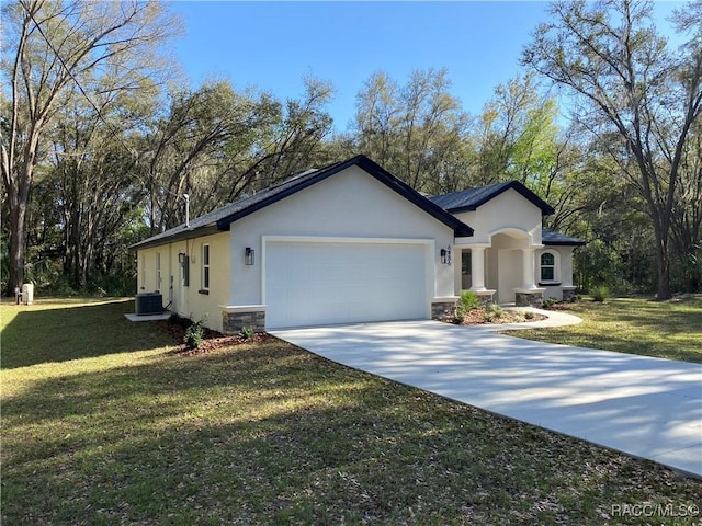 ranch-style home featuring central air condition unit, a front lawn, and a garage