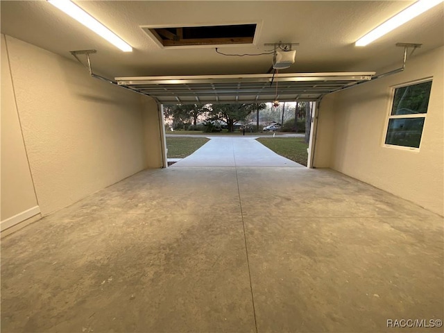 garage featuring a garage door opener