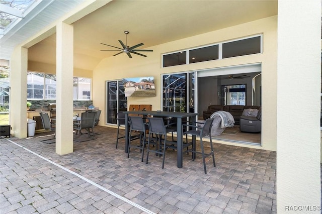 view of patio with a lanai and ceiling fan