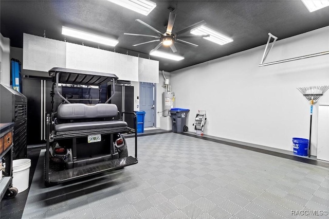 garage with electric water heater and ceiling fan