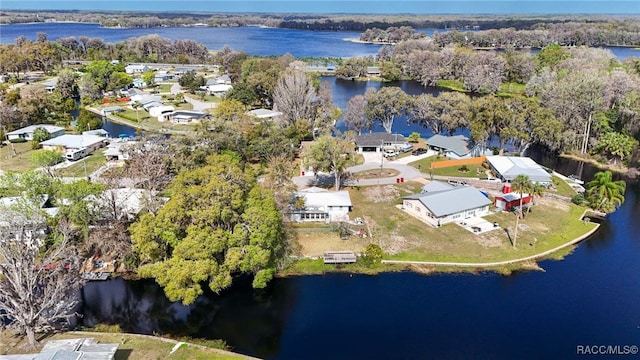 drone / aerial view featuring a water view and a residential view