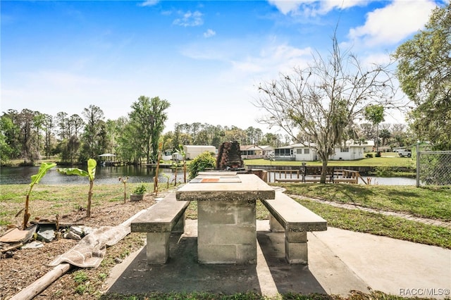 surrounding community featuring a water view