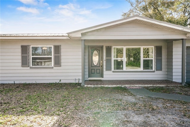 view of front of property featuring metal roof