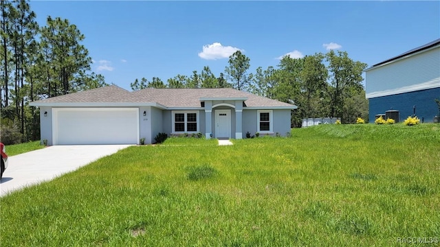 single story home featuring a front yard and a garage