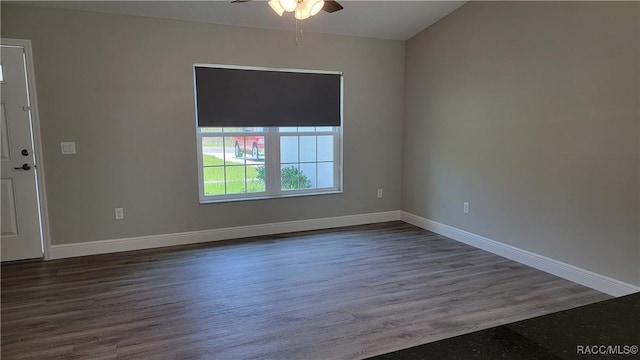 spare room featuring dark hardwood / wood-style floors and ceiling fan