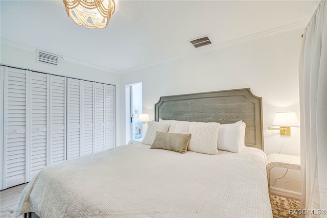 2310 N Watersedge Dr, Crystal River, FL 34429 - bedroom with ornamental molding, wood finished floors, and a chandelier