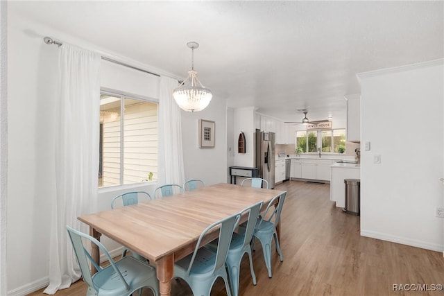 2310 N Watersedge Dr, Crystal River, FL 34429 - dining space with light wood-style floors and baseboards