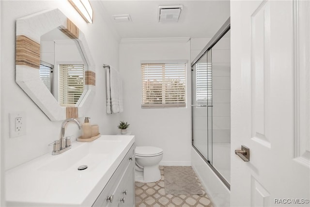 2310 N Watersedge Dr, Crystal River, FL 34429 - bathroom featuring vanity, shower / bath combination with glass door, tile patterned floors, and ornamental molding