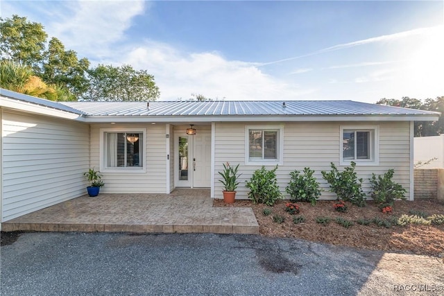2310 N Watersedge Dr, Crystal River, FL 34429 - ranch-style house with a metal roof