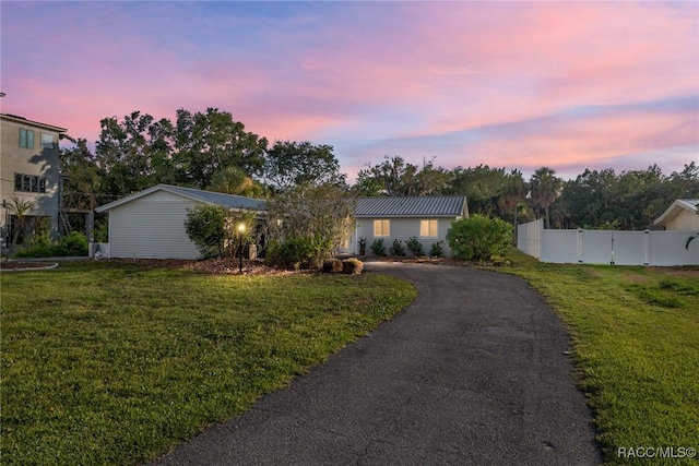 2310 N Watersedge Dr, Crystal River, FL 34429 - ranch-style home with asphalt driveway and a gate