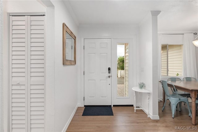 2310 N Watersedge Dr, Crystal River, FL 34429 - entrance foyer featuring wood finished floors and crown molding