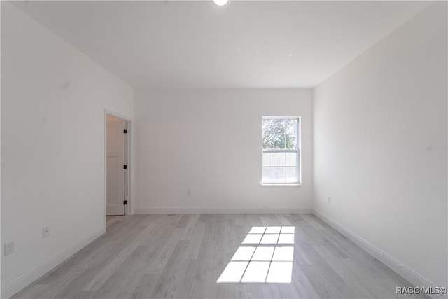 8589 N Sumter Ter, Dunnellon, FL 34433 - empty room with light wood-style flooring and baseboards