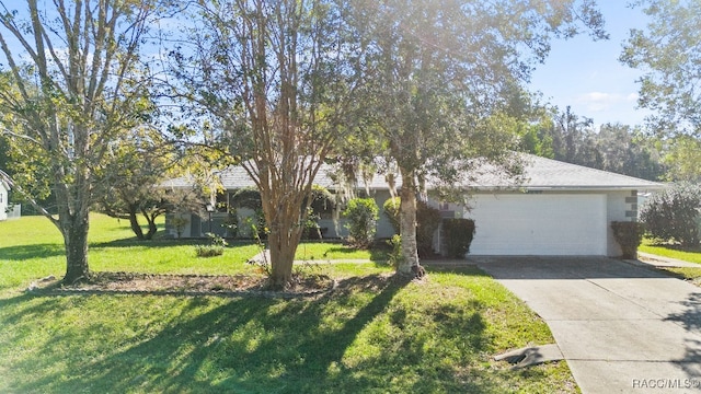 single story home featuring a front yard and a garage