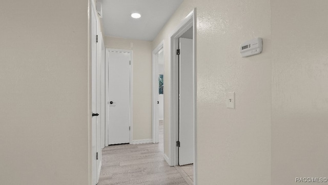 corridor featuring light hardwood / wood-style flooring