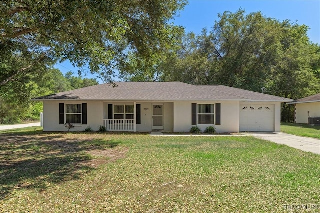 ranch-style home featuring a garage, a porch, driveway, and stucco siding