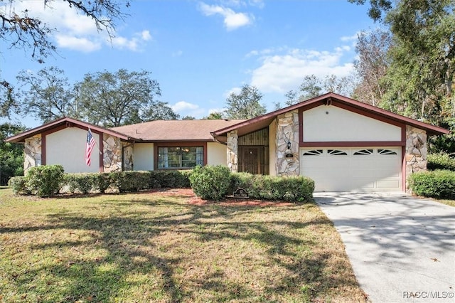 ranch-style house featuring a front yard and a garage