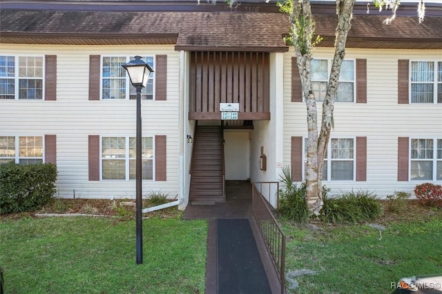 view of property with a front lawn