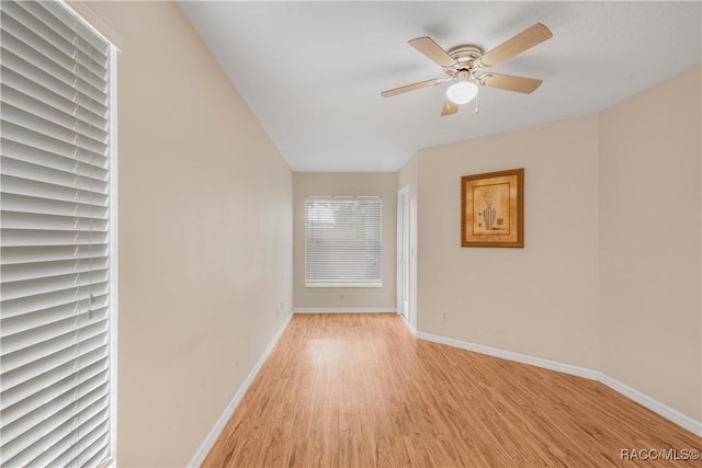 unfurnished room featuring ceiling fan and light hardwood / wood-style flooring