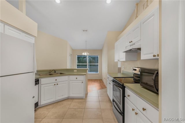 kitchen with pendant lighting, sink, white appliances, white cabinetry, and light tile patterned floors