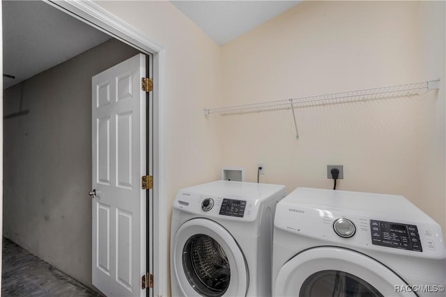 laundry room featuring washing machine and dryer